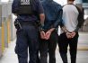 CBP officers at the San Ysidro Land Port of Entry in San Diego, California detain two male subjects for further inspection, October 25, 2023. CBP photo by Jerry Glaser.