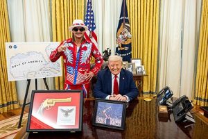 President Donald Trump signs an Executive Order alongside Kid Rock in the Oval Office, Monday, March 31, 2025. (Official White House Photo by Molly Riley)