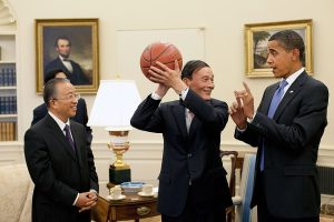 Pete Souza, Public domain, via Wikimedia Commons Chinese Vice Premier Wang Qishan, center, holds the basketball given to him by President Barack Obama following their Oval Office meeting Tuesday, July 28, 2009, to discuss the outcomes of the first U.S.-China Strategic and Economic Dialogue.  Looking on at left is Chinese State Councilor Dai Bingguo. (Official White House Photo by Pete Souza)

This official White House photograph is being made available for publication by news organizations and/or for personal use printing by the subject(s) of the photograph. The photograph may not be manipulated in any way or used in materials, advertisements, products, or promotions that in any way suggest approval or endorsement of the President, the First Family, or the White House. 