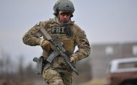 A member of the US Federal Bureau of Investigation's Milwaukee Special Weapons and Tactics team participtes in urban assault course training at range 41 at Fort McCoy Wis. on 27 April 2016.  Fort McCoy is one of three Total Force Training centers in the United states and trains more than 100,000 US military personel each year.  Many of the training facilities are also available to federal, state and local law enforcement.  Photo by Jamal Wilson