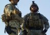 SANGIN, Afghanistan - A British Army officer, assigned to the 8th Armored Engineer Squadron, talks with a US Army Special Forces company commander, assigned to the Combined Joint Special Operations Task Force - Afghanistan, as they assess a compound for a new Afghan National Police headquarters in Sangin District, Helmand Province, on 9 April 2007.  Coalition and ANA forces have killed over 60 Taliban fighters during the past several days in the Sangin District area. (U.S. Army photo by Spc. Keith Henning) (Released)