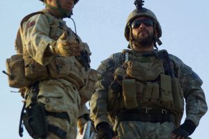 SANGIN, Afghanistan - A British Army officer, assigned to the 8th Armored Engineer Squadron, talks with a US Army Special Forces company commander, assigned to the Combined Joint Special Operations Task Force - Afghanistan, as they assess a compound for a new Afghan National Police headquarters in Sangin District, Helmand Province, on 9 April 2007.  Coalition and ANA forces have killed over 60 Taliban fighters during the past several days in the Sangin District area. (U.S. Army photo by Spc. Keith Henning) (Released)