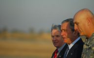 President of the United States, George W. Bush, talks with Gen. Ray Odierno, commanding general, Multi-National Force – Iraq and Ambassador Ryan Crocker after his arrival at Baghdad International Airport, Victory Base Complex, Iraq, Dec. 14.  Bush is in country for his last presidential visit with the troops.