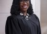 official portrait photograph of Justice Ketanji Brown Jackson taken September 20, 2024, the justice is pictured in her Judicial robe and a Visible collar made of Metal, and decorative stones / gems. This version is a 1/2 lenghth portrait. a headshot crop is also available.