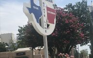 a sign saying texarkana state line with arkansas and texas on either side 
Texarkana is a city that straddles Texas and Arkansas,