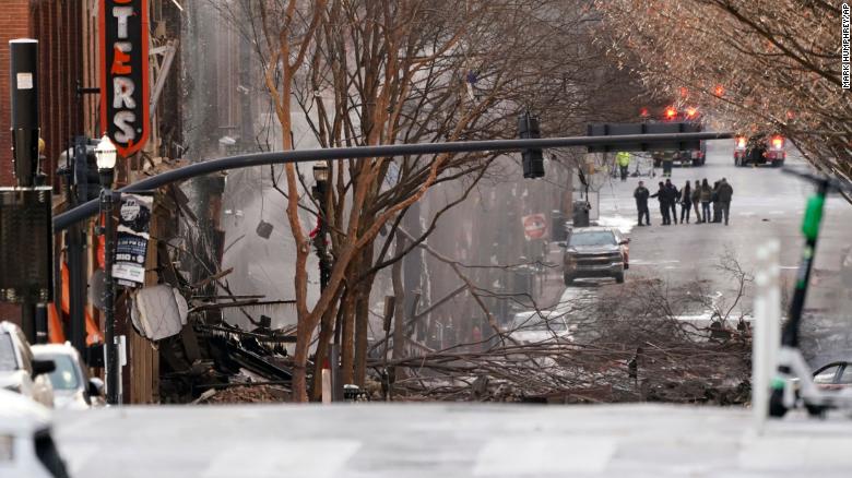 Emergency personnel work at the scene of the explosion.